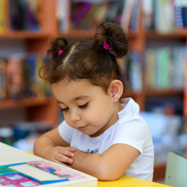little girl reading.